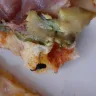 Roman's Pizza - pizza with fly