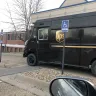 UPS - drivers speed in parking lot and parking across handicap path to building